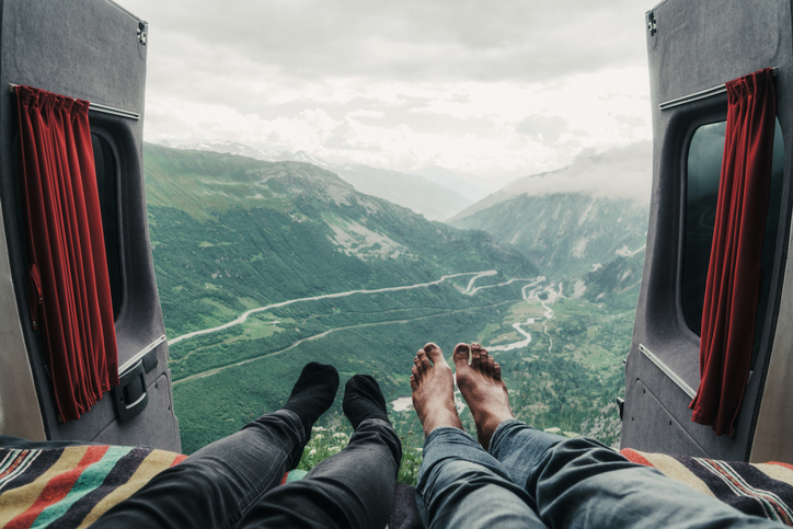 Couple laying with view on Furka pass