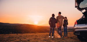 family camping watching sunset at national park